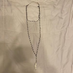 Long beaded necklace with feather pendant never worn